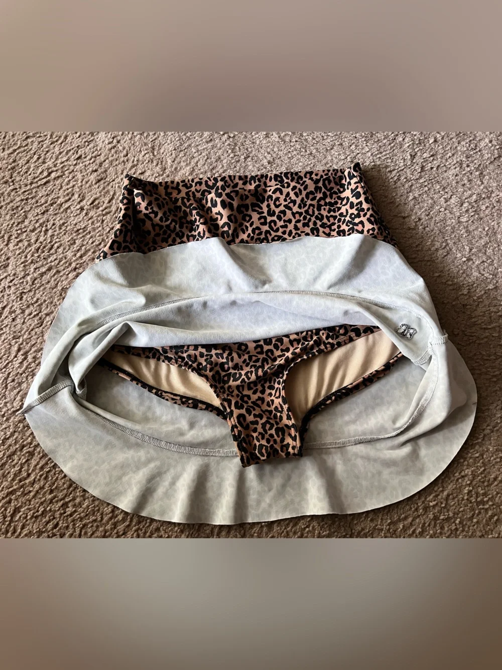 Albion Pursuit Fit High-Waisted Swim Skirt in a leopard/cheetah print Sz S